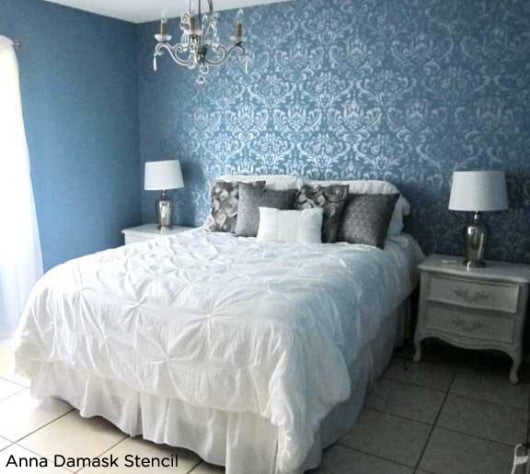 Stunning! Blue bedroom uses the Anna Damask Stencil to accent the wall and add a feminine touch!