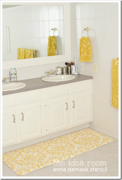 Add some excitement to the a plain white room with a stenciled rug using the Anna Damask Stencil.