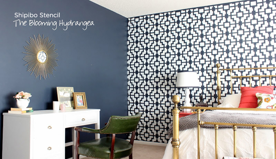 The Shipibo stencil really pops in this bedroom because of the high contasting colors like the navy blue against the white.