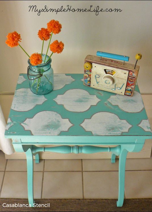 Adorable stenciled turquoise table using the Casablanca Stencil from Cutting Edge Stencil.