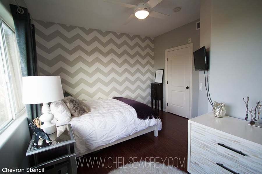 Love this! Beautiful chevron stenciled bedroom idea. The chevron striped pattern makes the accent wall pop.