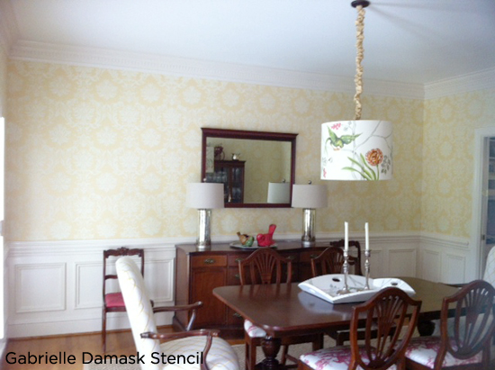 Classic dining room features the Gabrielle Damask Stencil from Cutting Edge Stencils in a beautiful shade of yellow.