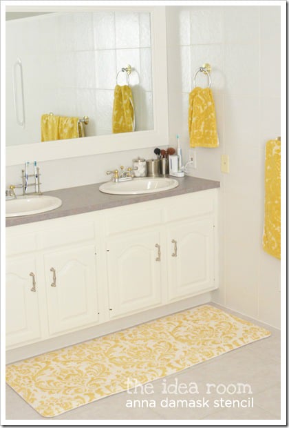 The Anna Damask Stencil in yellow adds the perfect pop of stenciled color to this bathroom! http://www.cuttingedgestencils.com/damask-stencil.html