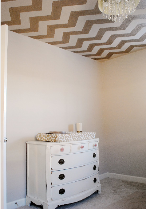 Use the Chevron Stencil from Cutting Edge Stencils in Modern Mettalic Gold to get this look!   http://www.cuttingedgestencils.com/chevron-stencil-pattern.html