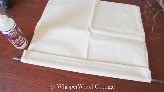 Grab your fabric adhesive. Apply generously along the edge of the pillow case. Fold the edge over the rod and press the fabric together. Give it adequate time to dry per instructions on the bottle. 