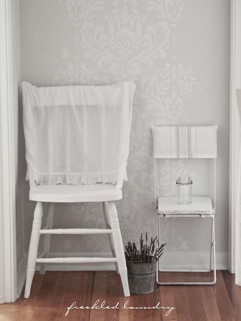 A white stenciled hallway using the Anna Damask wall pattern from Cutting Edge Stencils. http://www.cuttingedgestencils.com/damask-stencil.html