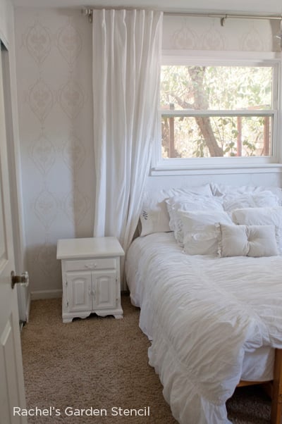 Stenciled white bedroom features the Rachel's Garden Allover Stencil from Cutting Edge Stencils. http://www.cuttingedgestencils.com/stencil-allover-pattern-2.html