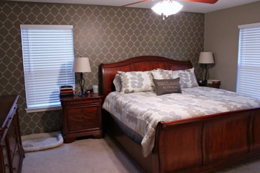 An Hourglass Allover stenciled brown accent wall in a bedroom.  http://www.cuttingedgestencils.com/modern-stencil.html