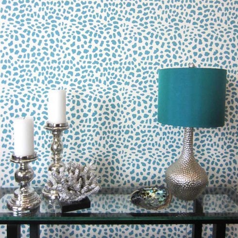 A blue Leopard Skin Allover stenciled accent wall. http://www.cuttingedgestencils.com/leopard-pattern-animal-skin-stencil.html