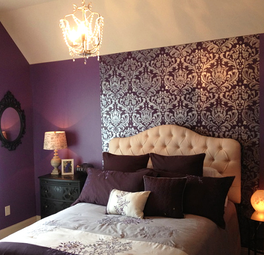 A purple bedroom with a DIY stenciled accent wall using the Anna Damask pattern. http://www.cuttingedgestencils.com/damask-stencil.html