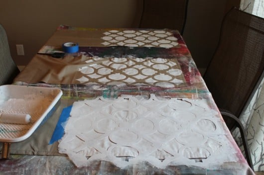 A DIY stenciled headboard and bedskirt using the Hand Forged Allover Stencil. http://www.cuttingedgestencils.com/hgtv-stencil.html