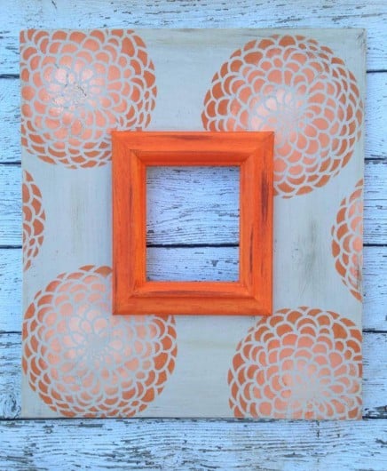 An orange ombre stenciled frame using the Zinnia Grande Stencil. http://www.cuttingedgestencils.com/flower-stencil-zinnia-wall.html