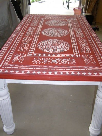 A red stenciled table using the Zinnia Grande Stencil and Indian Inlay Stencil kit. http://www.cuttingedgestencils.com/flower-stencil-zinnia-wall.html
