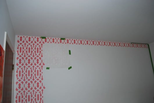 A stenciling shot of the DIY stenciled accent wall in a nursery.http://www.cuttingedgestencils.com/allover-stencil.html
