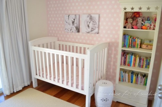 A DIY stenciled accent wall in a pink nursery using the Polka Dot Allover Stencil. http://www.cuttingedgestencils.com/polka-dots-stencils-nursery.html