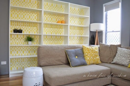 A DIY stenciled bookcase using the Trellis Allover stencil pattern in yellow. http://www.cuttingedgestencils.com/allover-stencil.html