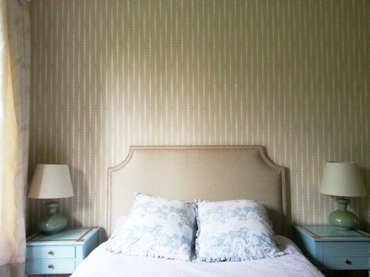 A beige DIY stenciled bedroom feature wall using the Beads Allover stencil pattern. http://www.cuttingedgestencils.com/beads-wall-stencil-pattern.html