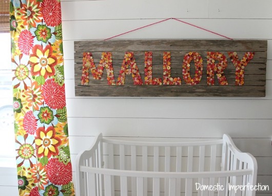 Reclaimed wood art using buttons. http://www.domesticimperfection.com/2014/08/nursery-sign-semi-fail/