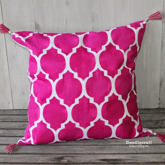 A custom DIY stenciled pillow using the Casablanca Paint-A-Pillow Kit and pink tassels. http://paintapillow.com/index.php/casablanca-paint-a-pillow-kit.html