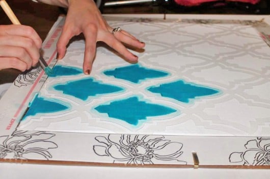 Stenciling the Oasis Paint-A-Pillow kit in turquoise. http://paintapillow.com/index.php/oasis-paint-a-pillow-kit.html