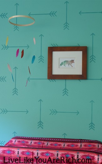 A DIY stenciled nursery using the Tribal Arrows pattern in turquoise. http://www.cuttingedgestencils.com/tribal-arrow-pattern-stencils-wall-decor.html