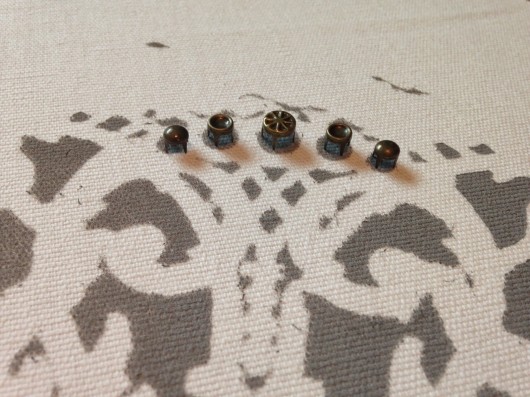 DIY stenciled pillows using the Antico Paint-A-Pillow kit embellished with Bronze studs. http://paintapillow.com/index.php/small-round-metal-studs-bronze.html