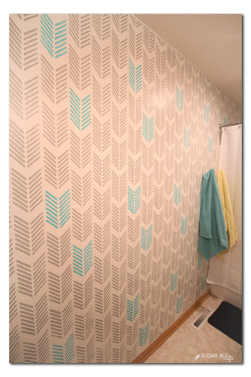 The Drifting Arrows wall stencil in a bathroom painted in gray and turquoise. http://www.cuttingedgestencils.com/drifting-arrows-stencil-pattern-diy-decor.html