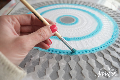 Stenciling a Paint-A-Pillow kit with a brush. http://paintapillow.com/index.php/funky-wheel-paint-a-pillow-kit.html