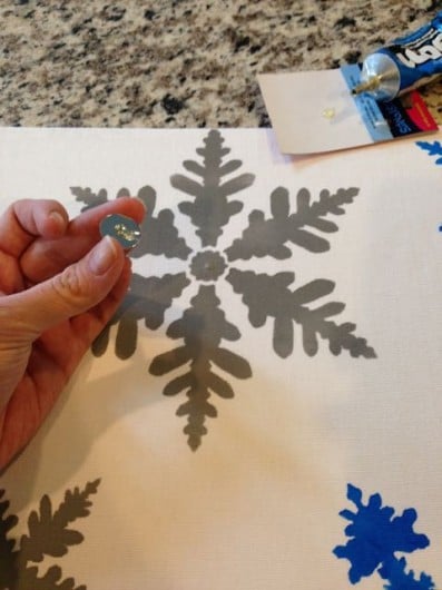 Adding rhinestones to the DIY Snowflakes Paint-A-Pillow kit. http://paintapillow.com/index.php/snowflakes-paint-a-pillow-kit.html
