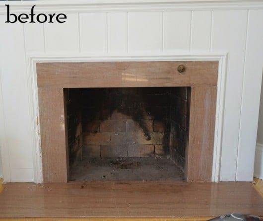 A before shot of a fireplace makeover.