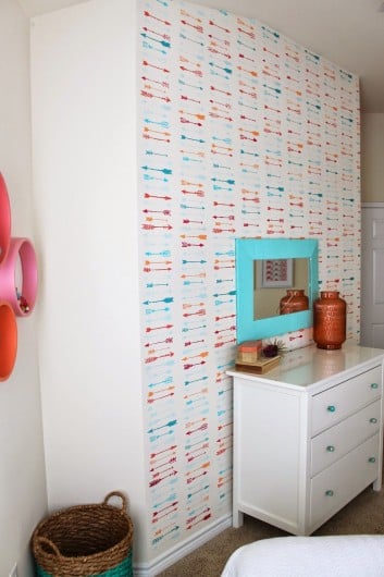 A DIY stenciled accent wall using the Indian Arrows Allover Stencil in a girl's room makeover. http://www.cuttingedgestencils.com/indian-arrows-stencil-pattern-for-walls.html