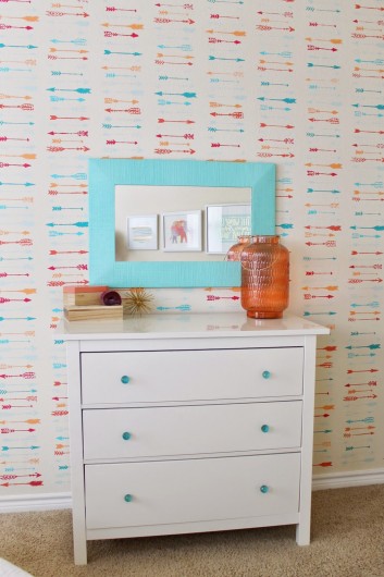 A DIY stenciled accent wall using the Indian Arrows Allover Stencil in a girl's room makeover. http://www.cuttingedgestencils.com/indian-arrows-stencil-pattern-for-walls.html