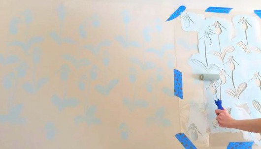 Stenciling a DIY accent wall in a bedroom using the Lady Slipper Allover pattern. http://www.cuttingedgestencils.com/orchid-floral-stencil-pattern.html