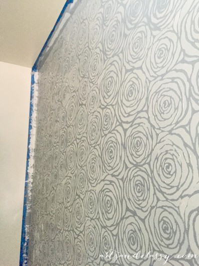 Stenciling a DIY kitchen accent wall using the Roses Allover Stencil in gray. http://www.cuttingedgestencils.com/roses-stencil-pattern-rose-design.html