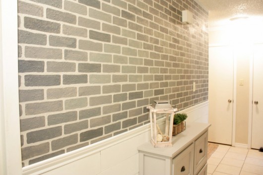 A DIY stenciled hallway using the Brick Allover Stencil pattern in gray. http://www.cuttingedgestencils.com/bricks-stencil-allover-pattern-stencils.html