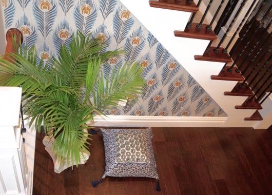 A DIY stenciled accent wall using the Peacock Feather Allover Stencil. Stenciling the Peacock Feather allover stencil pattern on an accent wall. http://www.cuttingedgestencils.com/peacock-feather-wall-stencil-pattern.html