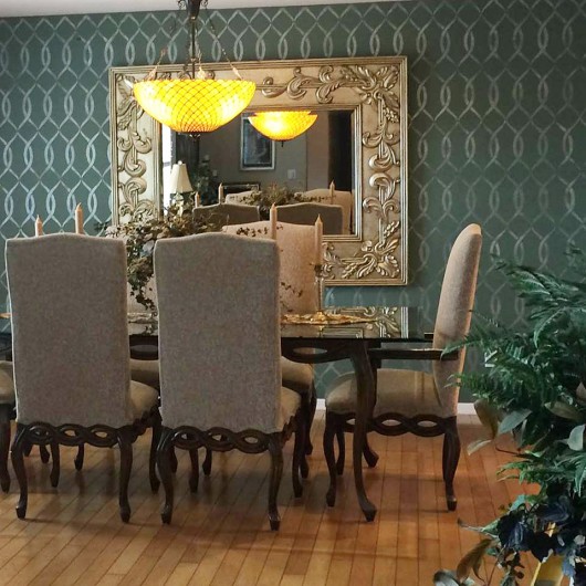 A DIY stenciled accent wall in a dark gray dining room using the Entwined Allover Stencil. http://www.cuttingedgestencils.com/stencil-pattern-2.html