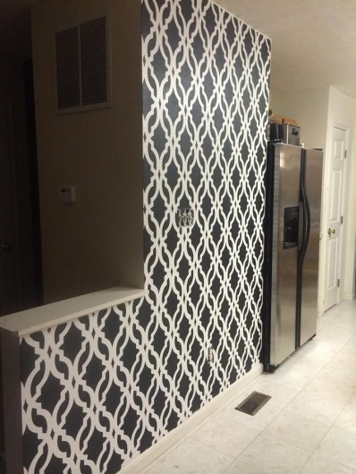 A DIY stenciled accent wall in black and white using the Tamara Trellis Allover Stencil. http://www.cuttingedgestencils.com/tamara-trellis-allover-wall-stencils.html