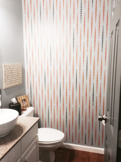 A DIY stenciled bathroom using the Beads Allover Stencil in orange and black. http://www.cuttingedgestencils.com/beads-wall-stencil-pattern.html