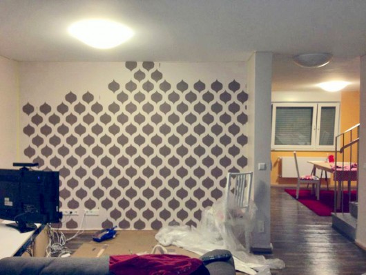 Stenciling a DIY accent wall in an apartment using the Cascade Allover Stencil. http://www.cuttingedgestencils.com/cascade-allover-stencil-pattern.html