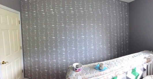A DIY stenciled accent wall in a nursery using the Indian Arrows Allover Stencil. http://www.cuttingedgestencils.com/indian-arrows-stencil-pattern-for-walls.html