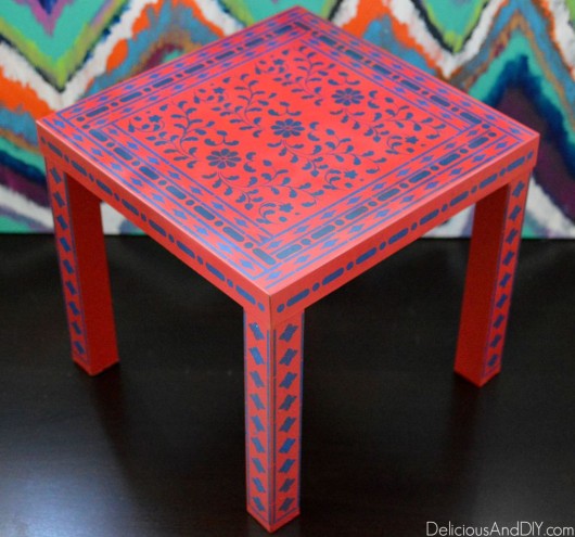 A DIY stenciled red and blue table using the Indian Inlay Stencil kit. http://www.cuttingedgestencils.com/indian-inlay-stencil-furniture.html