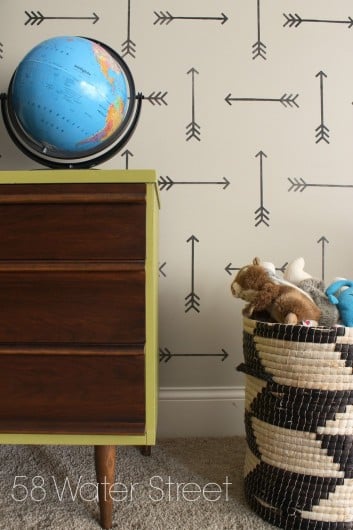 A DIY stenciled accent wall in a playroom using the Tribal Arrows Allover Stencil. http://www.cuttingedgestencils.com/tribal-arrow-pattern-stencils-wall-decor.html
