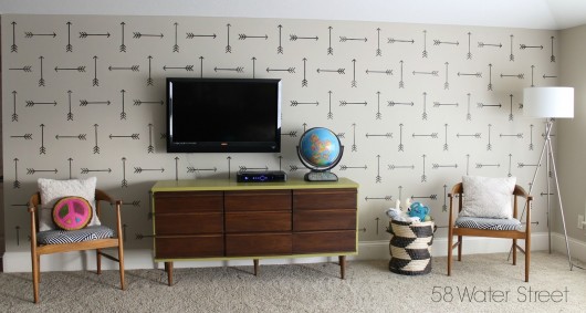 A DIY stenciled accent wall in a playroom using the Tribal Arrows Allover Stencil. http://www.cuttingedgestencils.com/tribal-arrow-pattern-stencils-wall-decor.html