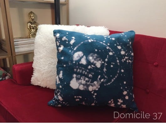 A DIY bleached and stenciled accent pillow using the Skull 1 Pillow Stencil Kit. http://www.cuttingedgestencils.com/skull-accent-pillows-for-diy-halloween-home-decor.html