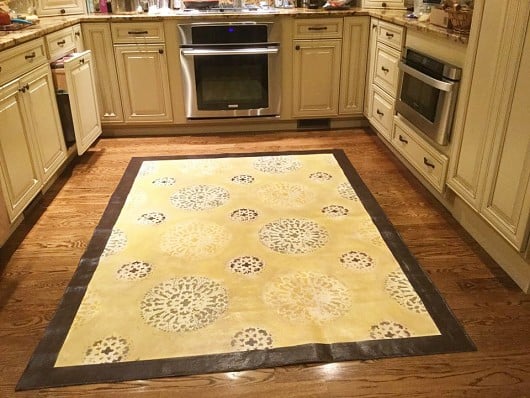 A DIY stenciled floorcloth for a kitchen floor using the Antico Allover Stencil. http://www.cuttingedgestencils.com/antico-allover-wall-pattern.html