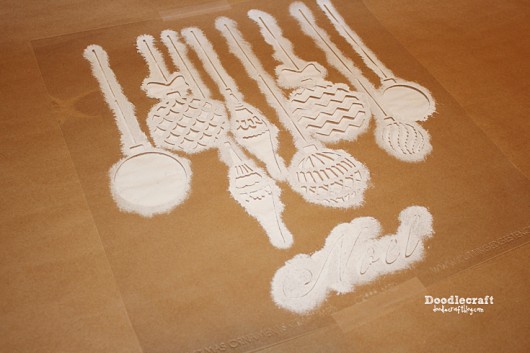 Stenciling DIY gift wrap using the Christmas Ornaments Craft Stencil from Cutting Edge Stencils. http://www.cuttingedgestencils.com/diy-christmas-decor-craft-and-furniture-stencils.html