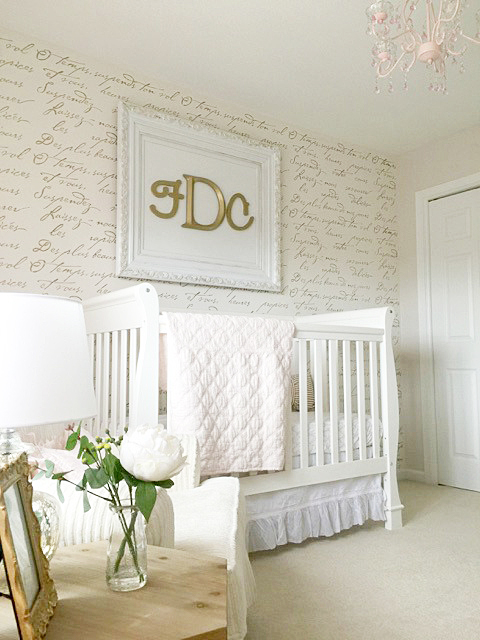A DIY stenciled accent wall in a nursery using the French Poem Allover Stencil from Cutting Edge Stencils. http://www.cuttingedgestencils.com/french-poem-typography-letter-stencil.html