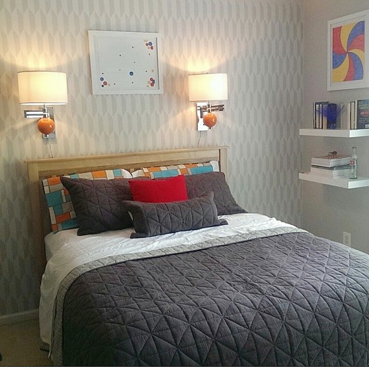 A DIY stenciled accent wall in a gray bedroom using the Prism Allover Stencil. http://www.cuttingedgestencils.com/prism-stencil-geometric-wall-pattern.html
