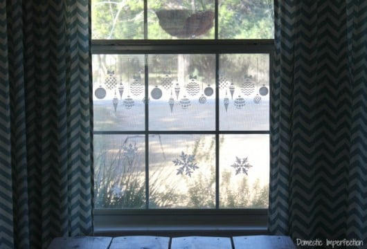 DIY stenciled windows using the Christmas Ornaments Stencil from Cutting Edge Stencils. http://www.cuttingedgestencils.com/diy-christmas-decor-craft-and-furniture-stencils.html